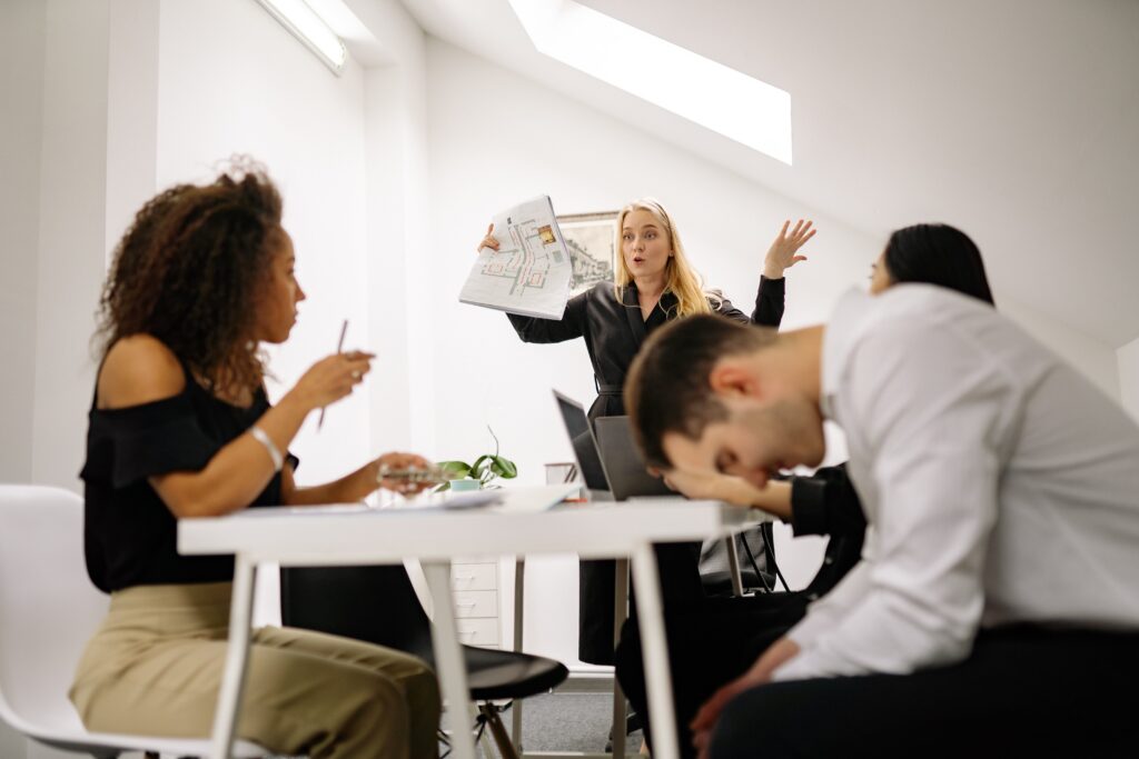  A team leader standing and screaming at her team.